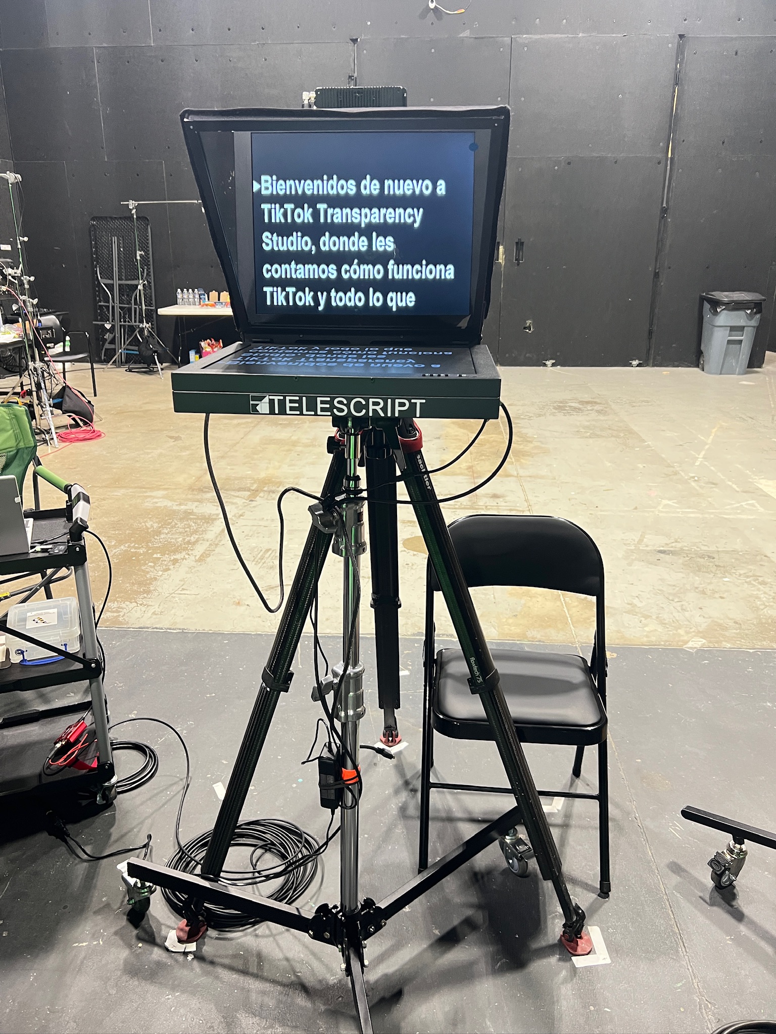 Telescript standup presidential teleprompter on a tripod beside a chair on a soundstage